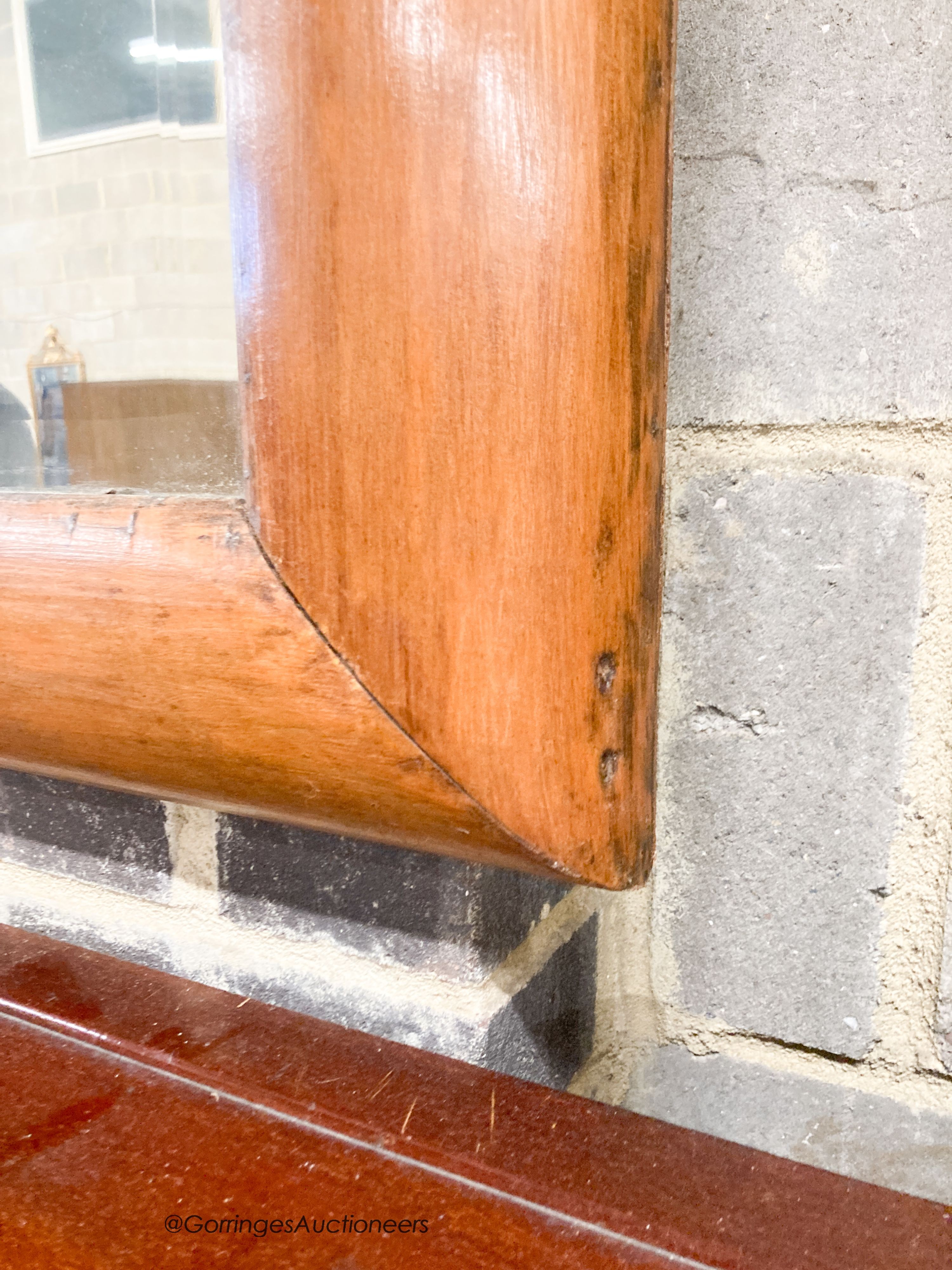 A late Victorian antique style pine cushion mirror, width 70cm, height 66cm